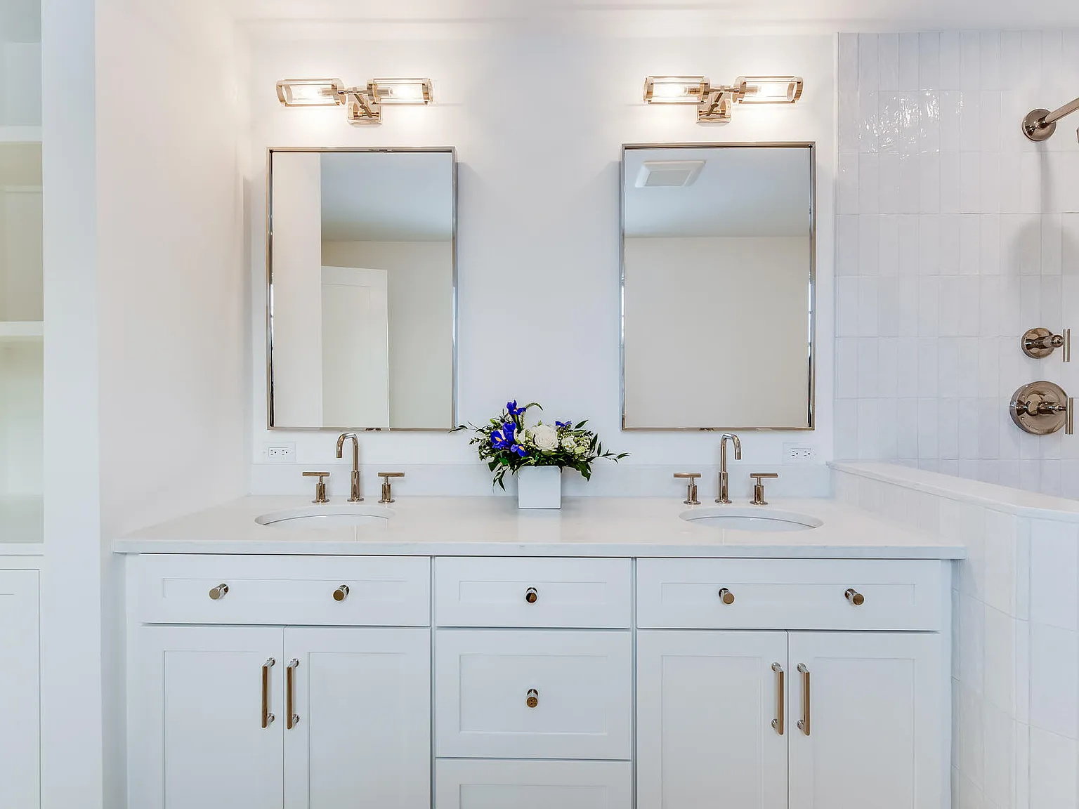 Primary bath vanity — double sinks, crystal sconces, nickel hardware